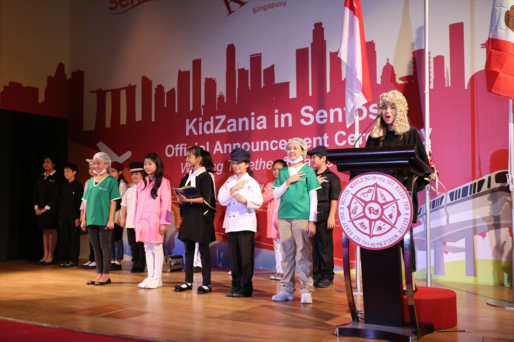 Kids reading the 'KidZania Declaration of Independence', declaring their independence from adults