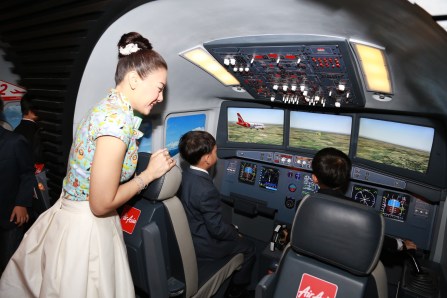 HRH Prince Dipangkorn Rasmijoti trying out one of KidZania Bangkok's flight simulators