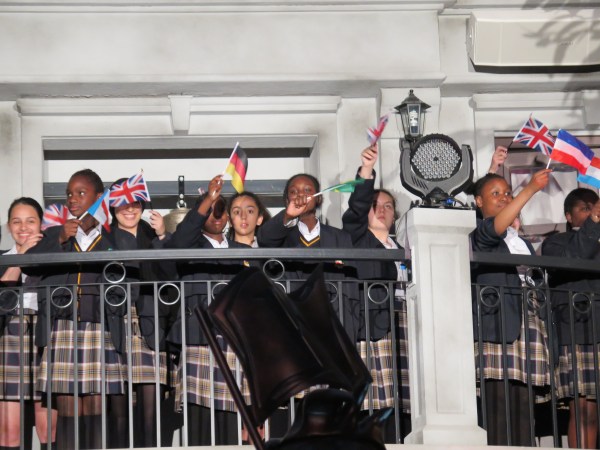A choir of kids singing the KidZania National Anthem